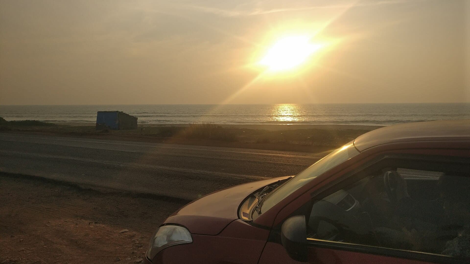 Scenic Karnataka coastal highway along the Arabian Sea at sunset - RV Tours & Travels